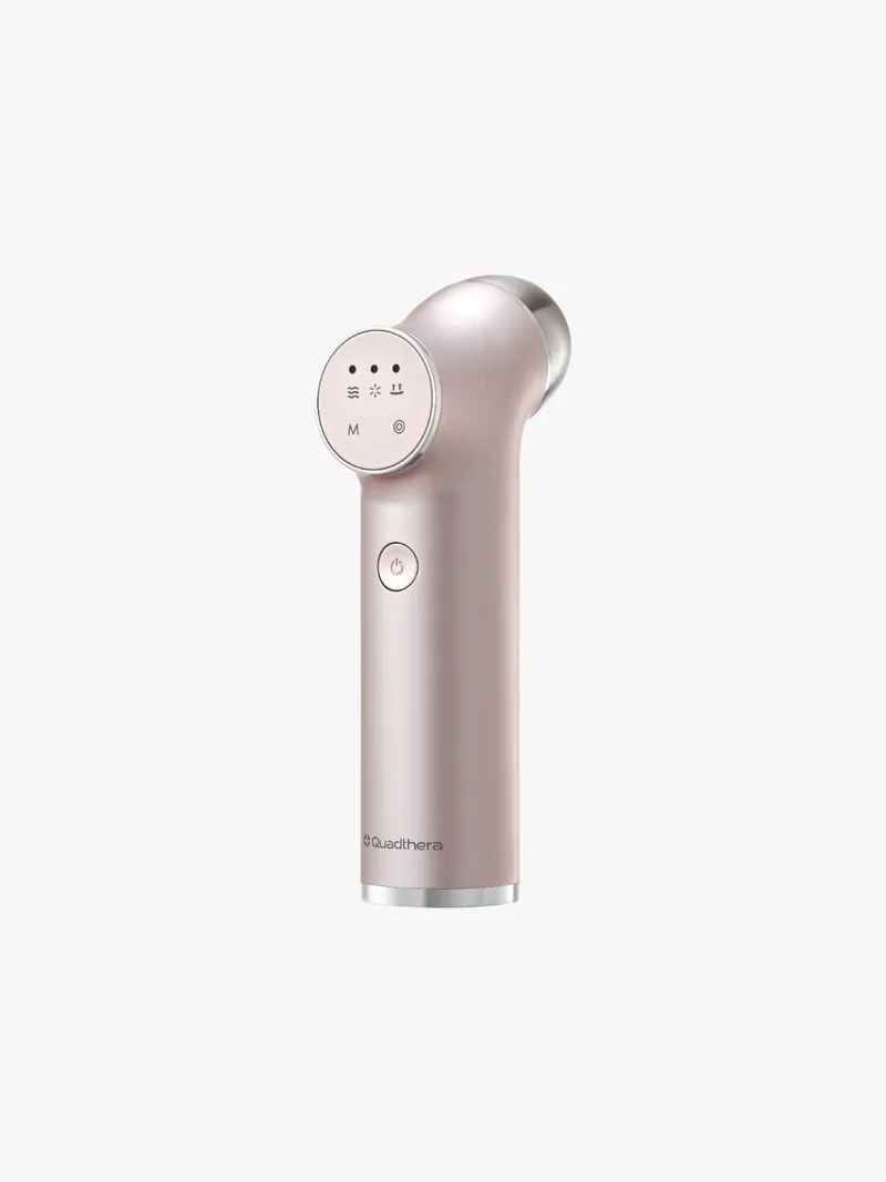 Quadthera MiniTitan handheld ultrasonic device in rose gold, front three-quarter view, on white